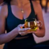 li-woman-holding-tea-night.jpg-pdp-w875h783 - Presidents Couple Cy Night Mode