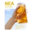 Mango_Fruit2 - Presidents Couple Cy Hand holding a clear bottle with a lemon slice in a tropical drink, on a light-blue panel with Mango Dragon Fruit text and Greek caption—NEA ΓΕΥΣΗ magazine cover.